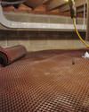 Crawl space drainage matting installed in a home in Amherst