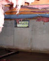 Nova Scotia & New Brunswick crawl space with vents, showing mold, rot, and fiberglass insulation dripping off the ceiling.