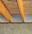 SilverGlo™ insulation installed in a floor joist in New Glasgow