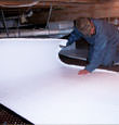 Dieppe insulation being installed in a crawl space.
