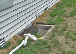 old concrete window well of a Fredericton crawl space