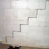 A diagonal stair step crack along the foundation wall of a Amherst home