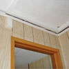 The ceiling and wall separating as the wall sinks with the slab floor in a Amherst home