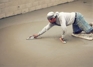 smoothing out the grout in a slab releveling project in Dieppe