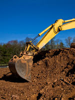 A backhoe excavating a foundation