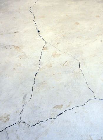 severely cracked, heaving slab floors in a home in Grand-barachois