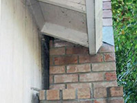 A chimney leaning away from the home on a Quispamsis foundation