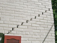 Stair-step cracks showing in a home foundation in Rothesay