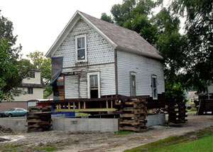 A severely damaged home foundation that is undergoing replacement in New Waterford.