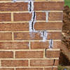 Tuckpointing that cracked due to foundation settlement of a Halifax home
