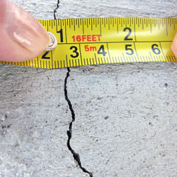 A crack in a poured concrete wall that's showing a normal crack during curing in Shediac