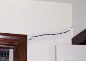A large drywall crack in an interior wall in Truro