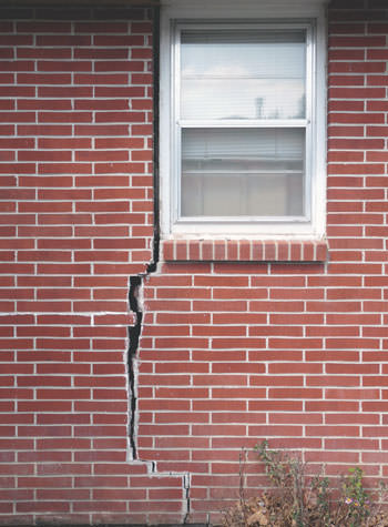 severe foundation wall cracks along a window in New Waterford