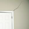 A long drywall crack beginning at the corner of a doorway in a Miramichi home.
