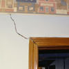 A large settlement crack on interior drywall in a Bedford home.