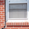 A gap in a window along the outer wall due to foundation settlement of a Saint John home.