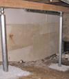 A system of crawl space support posts adding structural support to a crawl space in Shediac