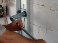 Mounting a foundation wall channel anchor in Dieppe.