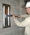 Tightening a wall anchor plate in Charlottetown, Nova Scotia & New Brunswick