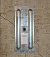 A fully exposed wall anchor plate installed along a Rusagonis foundation wall
