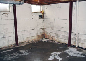 A failed, rusty i-beam foundation wall system installed in Antigonish.