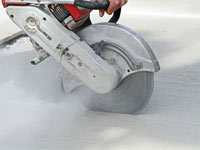 Cutting the driveway for expansion joints during street creep repair in Bridgewater