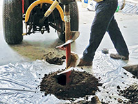 Digging the hole used for wall anchor installation in Yarmouth.