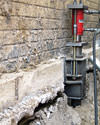 A completed installation of foundation push piers lifting a foundation in Bridgewater