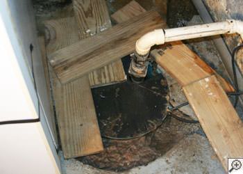An ugly, clogged sump pump system in Dieppe, Nova Scotia & New Brunswick