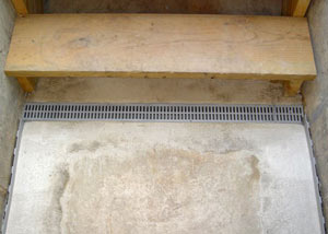 Our grated drain system installed on a leaking basement staircase in Antigonish.