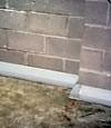 Our baseboard drain system installed on a corner in a Summerside basement.