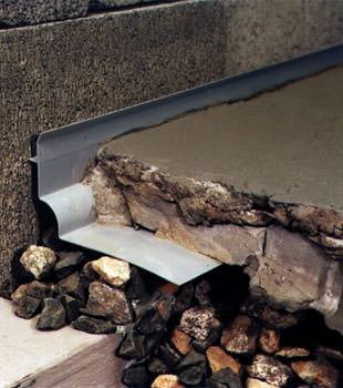 a custom designed basement drain system for thin basement floors in New Waterford.