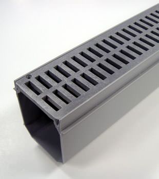 A closeup of our grated basement drainage pipe system, installed in Amherst