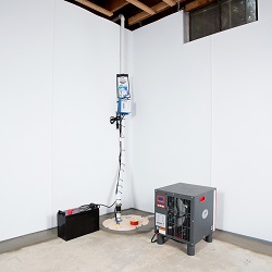 Sump pump system, dehumidifier, and basement wall panels installed during a sump pump installation in Saint John