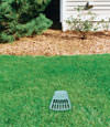 A buried gutter drain downspout extension installed in a Shediac home
